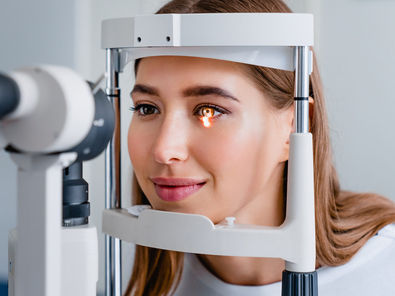 Eye doctor with female patient