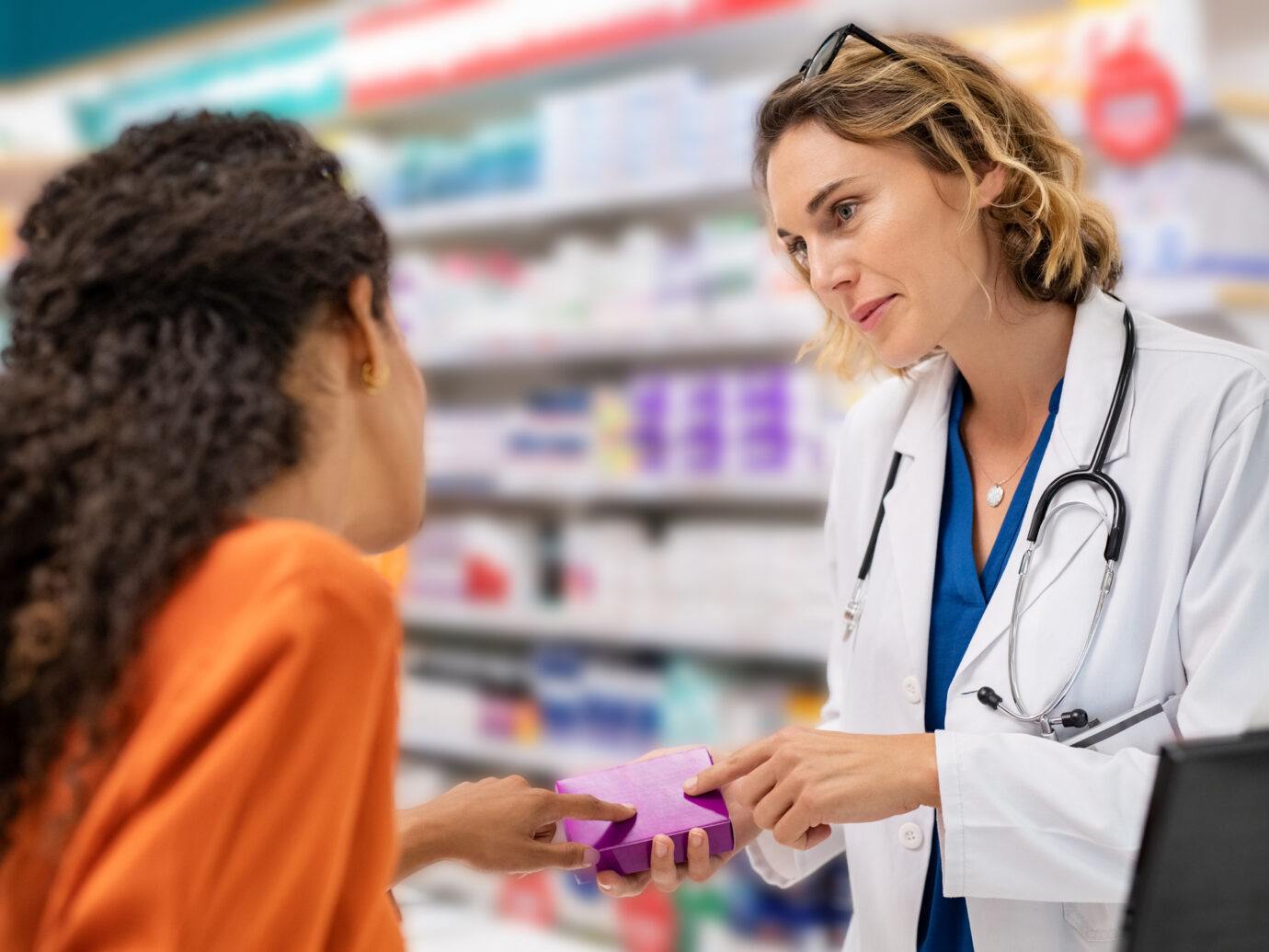 Pharmacist explains medicine to patient